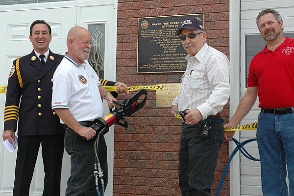 BB/CCN Photo/Bruce Colbert<br>
Mayer Fire Chief Glenn Brown officially re-dedicates Mayer Fire Station #1 this past Satuday after an extensive remodel. Board members Bob Kaufman and Bud Abbott cut the ribbon. The station is now staffed 24-hours-a-day seven-days-a-week.