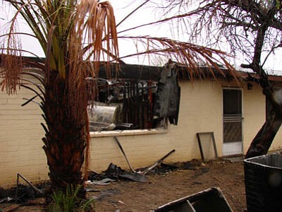 An early morning fire Saturday, Dec. 1, did major damage to this Black Canyon City home.
The occupants were out of the home when the Black Canyon Fire Department arrived on
scene and flames were shooting through the roof.