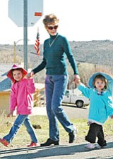 Isabelle Quinn, 5, grandma Gloria Croisant, and Kyla Quinn, 2, walk the parade route.<br>
BBN Photo/Heidi Dahms Foster