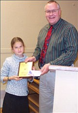 Yavapai County School Superintendent Tim Carter presents a certificate to Phoebe Teskey, who placed third in the Yavapai County Spelling Bee this year.<br>
Courtesy photo