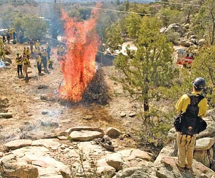 Students in the prescribed burn ignition class light brush piles at the former Highland Center property near Granite Mountain Middle School in Prescott this past Thursday. Black Canyon and Mayer firefighters attended academy classes.<br>
Photo courtesy Les Stukenberg