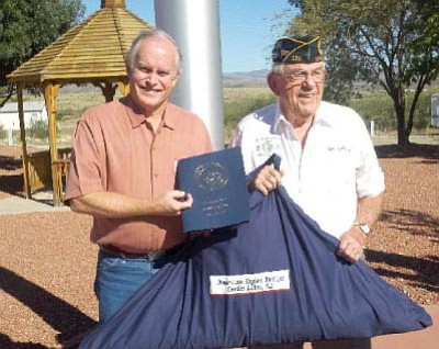 Sen. Steve Pearce presents Cordes Lakes American Legion Post 122 Commander Ron Johnson with a certificate and case containing a 12’ X 18’ flag that has been flying around the country.<br>Courtesy Photo

