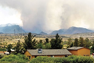 AP Photo/Tom Tingle<br>Smoke rising from the Gladiator Fire is seen from Spring Valley in May. Burn areas in and near Crown King are in danger of severe flooding in monsoon rains.