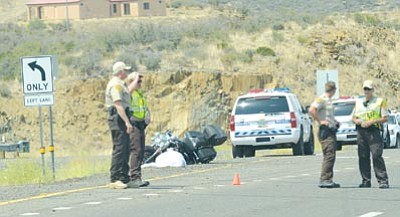 Heidi Dahms Foster, PV Tribune/Courtesy photo<br>An officer directs traffic after a Saturday accident on Highway 69 north of Poland Junction.