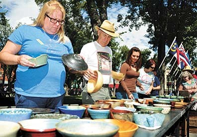 Daily Courier/file<br /><br /><!-- 1upcrlf2 -->People look for the perfect bowl for their soup during a past Empty Bowls fundraiser on the Yavapai County Courthouse Plaza. This year’s Empty Bowls fundraiser will be Sunday, Sept. 13.<br /><br /><!-- 1upcrlf2 -->