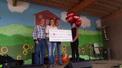 Gary, Sharla and Hayden Mortimer with Jessica Martin, director of Major Gifts & Foundation Giving of Phoenix Children’s Hospital. (Courtesy photo)