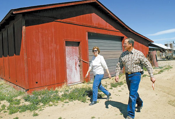 Special to the Review/Jo. L. Keener<br> 
Kay Jones Chino Valley Historical Society president, left and Roger Strader Historical Society vice president walk around a old barn at the Cooper Agricultural Center Friday afternoon. The society wants to convert the old barn to a museum for Chino Valley’s history.