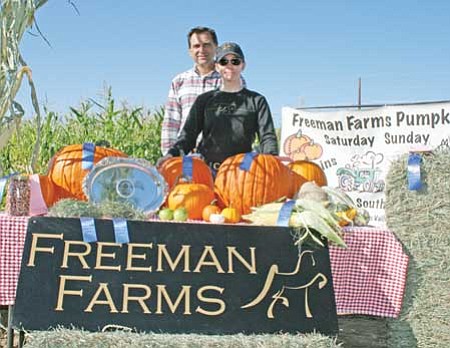 Review/Salina Sialega<br /><br /><!-- 1upcrlf2 -->Lynne Trenery and Norm Freeman, co-owners of Freeman Farms in Chino Valley, show the nine blue ribbons and the produce that won them at the Yavapai County Fair last month, including Best Variety of Pumpkins, Best Connecticut Field Pumpkin, Heaviest Real Pumpkin, Bes Sweet Corn, Best Silage Corn, Best Grass Hay, Best Shelled Indian Corn, Best Grass Hay Sheaf and Best Alfalfa Hay Sheaf, along with a silver platter for “Field Crop Winner” at the fair.