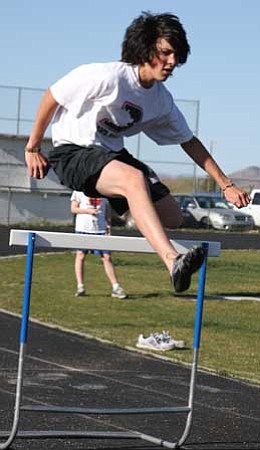 Dennis Habersack, an exchange student from Germany who’s attending Chino Valley High School and is on the track team, clears a hurdle.
