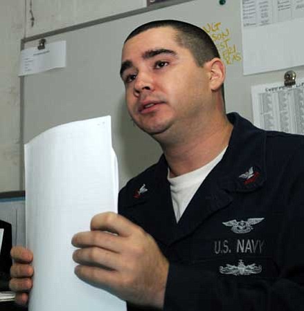 Courtesy/Official U.S. Navy photo by MC3 Briana Brotzman<br /><br /><!-- 1upcrlf2 -->Storekeeper 2nd Class Jason Rockney, 29, manages aircraft<br /><br /><!-- 1upcrlf2 -->parts aboard the nuclear-powered aircraft carrier, the USS Ronald Reagan, currently in the Gulf of Oman.<br /><br /><!-- 1upcrlf2 -->