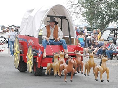Matt Santos/Courtesy photo<br>
Jeff Stewart of the Chino Valley Fire Department drives the Firefighters Foundation team of inflatable ponies during the Territorial Days Parade.