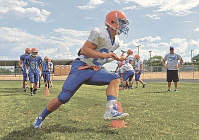 Matt Hinshaw/PNI<br /><br /><!-- 1upcrlf2 -->Chino Valley's Jared Chavez runs a route drill Friday afternoon during team practice at Chino Valley High School.