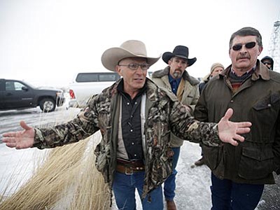 LaVoy Finicum, a former Paulden resident, speaks to the media Jan. 9 after members of an armed group along with several other organizations arrive at the at the Malheur National Wildlife Refuge near Burns, Oregon. The FBI and Oregon State Police arrested the leaders of an armed group that has occupied a national wildlife refuge for the past three weeks during a traffic stop that prompted gunfire — and one death — along a highway through the frozen high country. The Oregonian reported that Finicum was the person killed, citing the man's daughter. (Rick Bowmer/The AP, file)