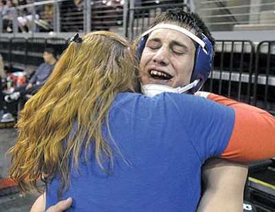 Chino Valley’s Spencer Coffin gets a big hug from his mom Jaime after winning the AIA Division III State Championship Saturday night at the Prescott Valley Event Center. (Matt Hinshaw/PNI)