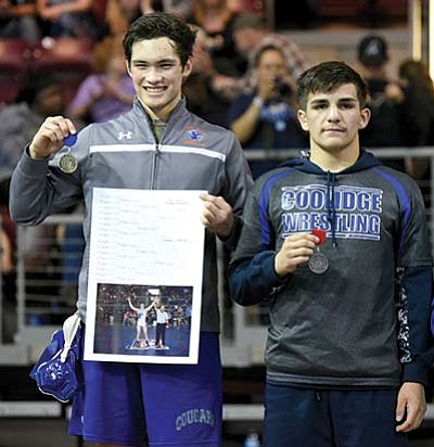 Chino Valley High School’s Gary Medevielle (left) smiles while holding his state championship medal while standing next to Collidge’s Jesus Zamorano Saturday. (Matt Hinshaw/PNI)