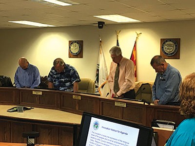 Councilmember Mike Best (second from right) delivers the final public invocation for the Chino Valley Town Council at the Tuesday, April 12 meeting. The council voted after this to conduct all future invocations in private before meetings begin because of threats of lawsuits over its policy. (Ken Sain/Review)