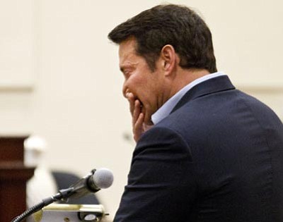 Rob Schumacher/The Associated Press<br>
Self-help author James Arthur Ray cries as he asks for forgiveness from the families of his victims during his sentencing at Yavapai County Courthouse in Prescott Friday. Ray received a prison sentence of two years for each of the three victims of the October 2009 sweat lodge tragedy. The three two-year sentences will be served concurrently.