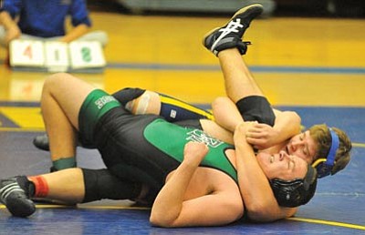 Prescott's David Rupp tries to pin Mountain Ridge's Jessen Hawks Wednesday afternoon in the 285 pound weight class during a PHS home wrestling meet.