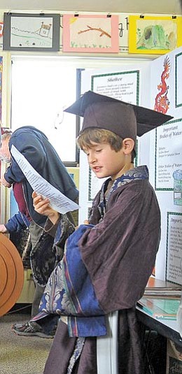 Matt Hinshaw/The Daily Courier<br>
Tate Knowles, 9, gives a presentation on ancient China to a group of parents Wednesday morning during Primavera Elementary School’s Living Museum event.