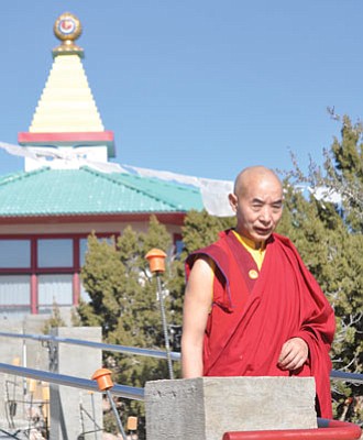 Nicholas DeMarino/The Daily Courier<br>The Venerable Lama Bunima walks the grounds surrounding the Garchen Buddhist Institute east of Chino Valley.