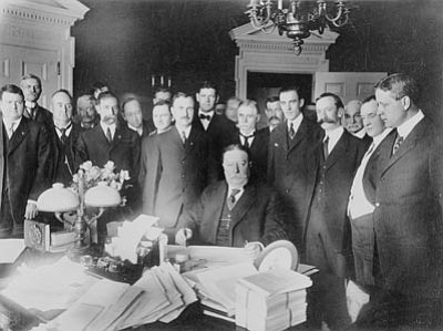 Ralph Cameron stands in the foreground at the right shoulder of President William Howard Taft as he signs the document making Arizona the 48th state admitted to the Union on February 14, 1912.<br>

Sharlot Hall Museum/Courtesy photo