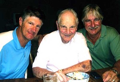 Art Converse, center, and his sons. <br> Courtesy Photo