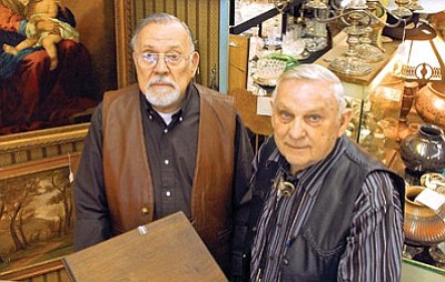 Dale Coffey, left, and Bill Swift, owners of Red Lamp Antiques on Cortez Street, stand in their store in Prescott.<br>
The Daily Courier, file photo/Matt Hinshaw