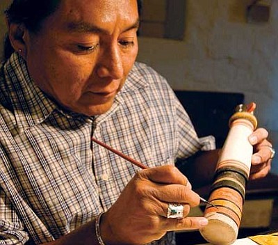 Artist Duane Tawahongva from Second Mesa, Ariz. paints detail on a traditional Hopi Kachina during the Christmas Indian Art Market at the Smoki Museum in Prescott on Sunday afternoon.<br>
The Daily Courier, file photo/Matt Hinshaw