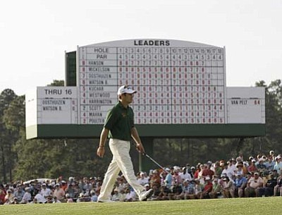 Louis Oosthuizen, of South Africa, walks on the 18th green during the fourth round of the Masters golf tournament Sunday, April 8, 2012, in Augusta, Ga. (AP Photo/David J. Phillip)