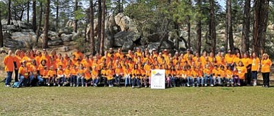 Matt Hinshaw/The Daily Courier<br>
Participants in the Christian Academy of Prescott Laps for Education event gather together for a group photo Friday morning at Camp Pine Rock in Prescott. Students, teachers, volunteers and parents ran laps to raise money for computers, projectors, and other forms of technology.