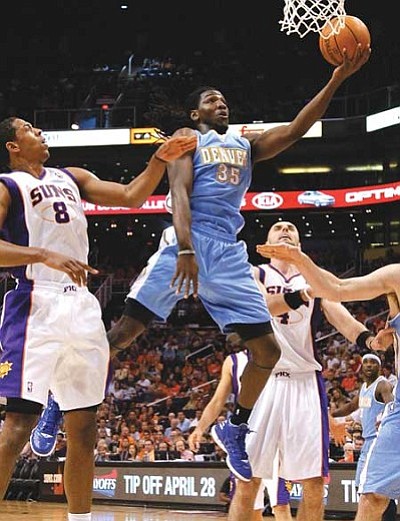 Matt York/The Associated Press<br /><br /><!-- 1upcrlf2 -->The Nuggets’ Kenneth Faried (35) drives past the Suns’ Channing Frye (8) during the first half Saturday in Phoenix. The rookie had 18 points and 13 <br /><br /><!-- 1upcrlf2 -->rebounds.