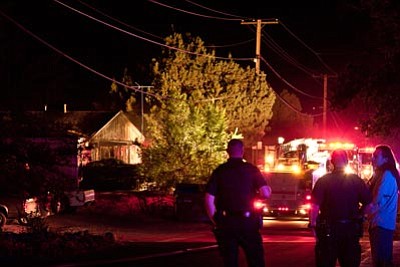 Cassandra Geiser/Courtesy photo<br>Prescott firefighters extinguished a fire and police officers helped with crowd control at a fire in the 100 block of South Rush Street early Friday.