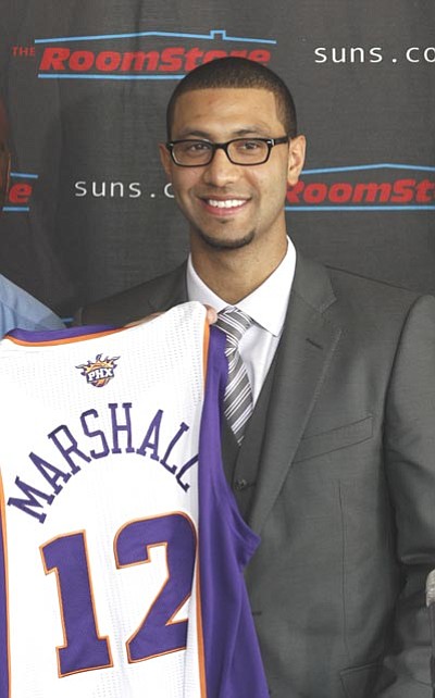 Ross D. Franklin/The Associated Press<br /><br /><!-- 1upcrlf2 -->Kendall Marshall smiles as he is introduced by the Suns Friday in Phoenix.
