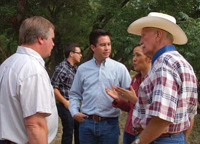 Cindy Barks/The Daily Courier<br>
About 100 people from Prescott and its Sister City in Caborca, Sonora, Mexico gathered at Jim and Barb Buchanan’s Sundown Ranch Saturday evening to celebrate the 40th anniversary of the Prescott/Caborca bond. Here, from left, Prescott City Councilman Chris Kuknyo, Caborca Mayor Dario Murillo, Frany Soto, and Prescott Sister City member and president of Arizona Sister Cities Robert Greninger chat prior to the anniversary dinner.