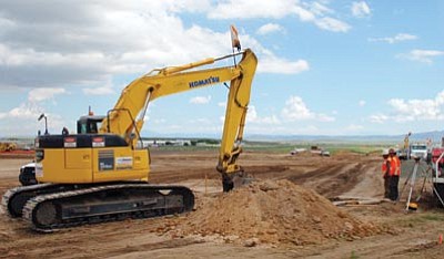 Cindy Barks/The Daily Courier<br>
Crews work on a project at the Prescott Airport that will improve safety by increasing the buffer area between the western end of the runway and Highway 89. 
