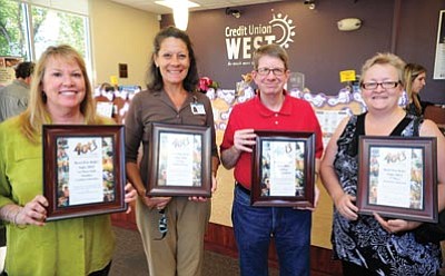 Les Stukenberg/The Daily Courier<br>
Yavapai Big Brothers Big Sisters on Thursday presented certificates and gifts to Cynthia Schleicher, Ronda Holtom, Jeffrey Jackson and Dyh Anderson – the four people who raised the most money for the 2012 Bowl For Kids Sake event.