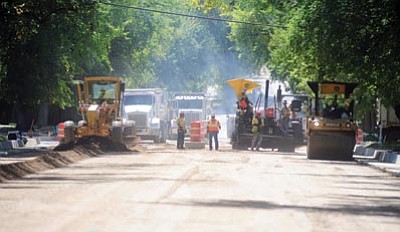 Les Stukenberg/The Daily Courier<br>Workers with Fann contracting continue working on the Mount Vernon/Senator Highway repaving project that was delayed by the strong monsoon rains.