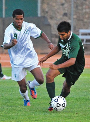 Matt Hinshaw/The Daily Courier<br>Yavapai’s Jonathan Grant (9) chases down Scottsdale’s Julio Carranza (23) Tuesday evening at Ken Lindley Field in Prescott.