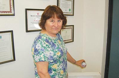 Ken Hedler/The Daily Courier<br>
Toby Frost, manager of environmental services for Western Technologies Inc. in Prescott, displays a canister that she uses to test for radon gas from air samples. Federal Radon Action Week, which concludes Sunday, draws attention to the potential dangers radon poses inside homes. 


