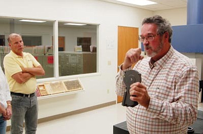 Ken Hedler/The Daily Courier<br>Michael Dailey, right, president and general manager of Prescott Aerospace Inc. in Prescott Valley, talks about the company during a tour he conducted for the Town Council Thursday evening. Vice Mayor Don Tjiema is to his left.