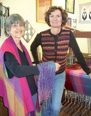 Courtesy photo<br>
Janet Lambert, right, and Wilda Postel show off some items that the Mountain Spinners and Weavers Guild will have for sale Saturday at the Hassayampa Inn. The Prescott Area Woodturners will also show and sell their wares in the annual event.
