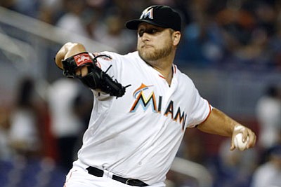 Lynne Sladky/The Associated press<br>A huge trade Tuesday saw the Miami Marlins unload three star players, including starting pitcher Mark Buehrle, to the Toronto Blue Jays.