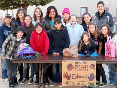 Courtesy Photo<br>Liberty Traditional School sixth-grade teacher Danette Derickson and her students collected warm clothing recently for people in New York, New Jersey and Connecticut affected by Hurricane Sandy.