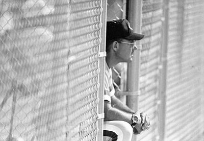 Courier file<br>Tom Pratt watches his Cougars from the dugout during a game in Chino Valley on May 7, 1994.