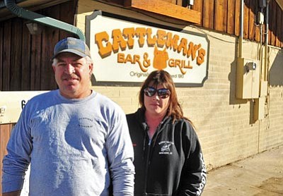 Matt Hinshaw/The Daily Courier<br>Greg Senst, new owner of the Cattleman’s Bar and Grill, poses with his general manager Rena Warren outside of his restaurant Wednesday afternoon in Prescott.  Senst is planning on re-opening Cattleman’s Bar and Grill on Dec. 21.