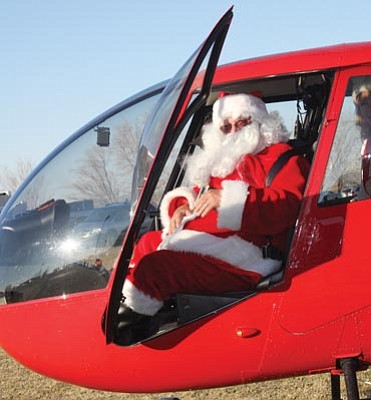 Courtesy Geri Kinsley/Chino Valley review<br>Santa checked out his seat on the Guidance Aviation helicopter this past week in preparation for his appearance at Chino Valley Chamber of Commerce’s Hometown Chino Christmas on Dec. 14 and 15 at Heritage Middle School.