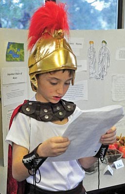 Matt Hinshaw/The Daily Courier<br>Primavera School third-grade student Brendan Dicker, 8, gives a presentation on the Roman civilization during the Living Museum of Ancient Civilizations event Tuesday morning in Prescott.