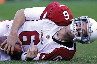 The Associated Press<br>
ABOVE: Cardinals quarterback Brian Hoyer lies on the field after being sacked by San Francisco 49ers linebacker Ahmad Brooks on Sunday in San Francisco. 
BELOW: Cardinals inside linebacker Daryl Washington tackles 49ers wide receiver Michael Crabtree. The 49ers won the game 27-13.