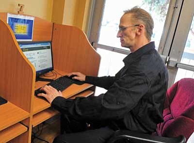 Matt Hinshaw/The Daily Courier<br>
Air Force Veteran Darryl Silvius works on a computer inside the U.S. VETS building at the Bob Stump VA Medical Center in Prescott Friday morning. Silvius is currently a student at Yavapai College working on a degree in business management.