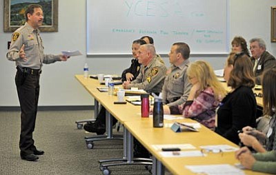 Matt Hinshaw/The Daily Courier<br>Yavapai County Sheriff Scott Mascher talks to fellow law enforcement officers, school principals, and other school administrators about school safety plans at the Aspire Junior/Senior High School in Prescott Thursday.